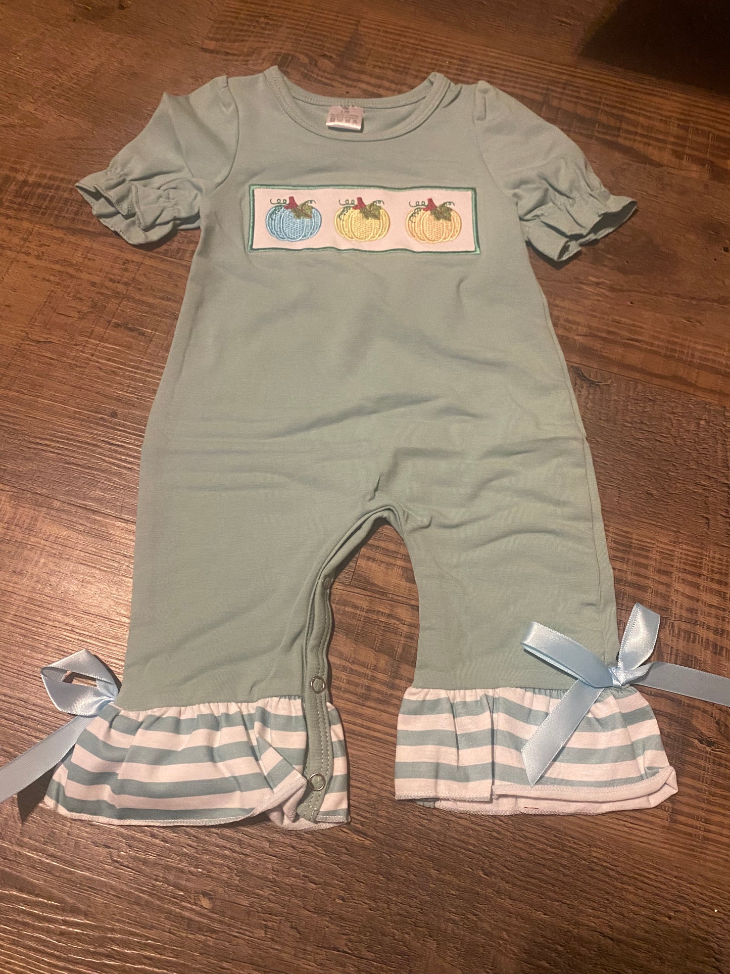 Girls ruffle green pumpkin trip romper